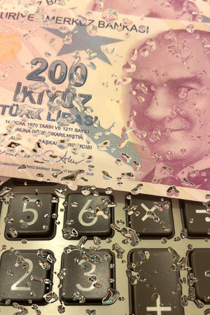 Turkish Lira and Calculator Finance Concept.200 TRY banknotes on calculator representing Turkish...