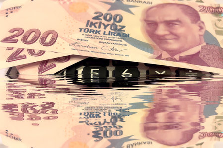 Turkish Lira and Calculator Finance Concept.200 TRY banknotes on calculator representing Turkish economy, budgeting, and financial planning.の写真素材