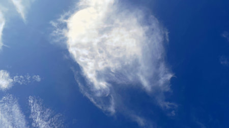 blue sky background with white clouds. Cloudy sky. White fluffy clouds in the blue sky.の写真素材