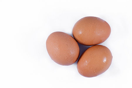 Three eggs isolated on white background