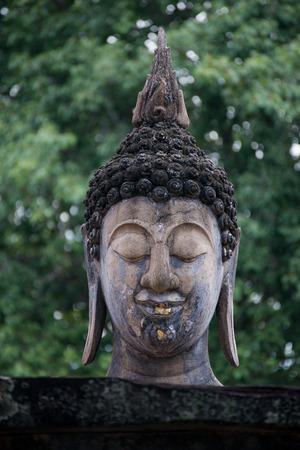 The statue of Buddha placed in the Asian temple for blessing or traditional ceremony.の写真素材