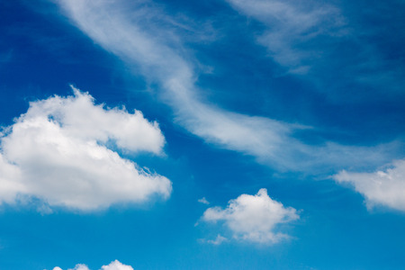 Blue sky and puffy clouds