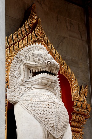 large singhas (lion) guarding the entrance to Wat Benchamabophit Dusitvanaram,Bangkok, Thailandの写真素材