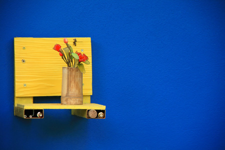 bamboo flower vase on a blue backgroundの写真素材