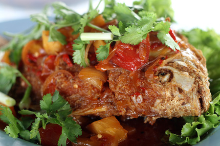 Fried fish with sweet and spicy sauceの写真素材