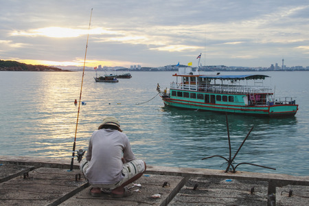 Local man goes fishing for food in the morningの写真素材
