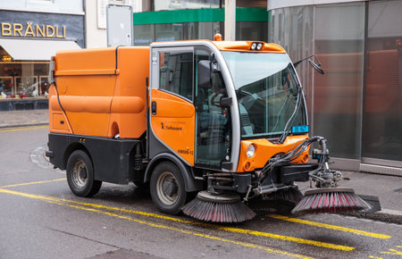 Basel, Switzerland - March 31, 2018: Street cleaning vehicle on a street in Basel