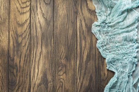 Gauze tablecloth from right side wooden table top view. food backgroundの写真素材