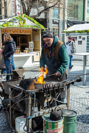 Prague, Czech Republic - March 29, 2018: The blacksmith at the forge in tourist areas on Old Town in Pragueのeditorial素材