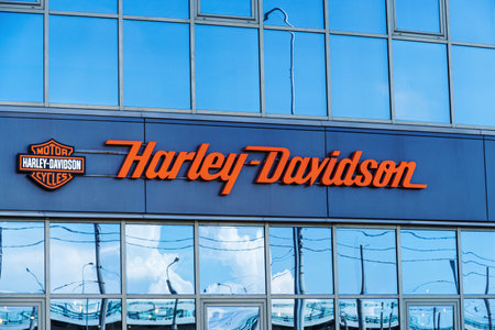 Russia, Saint-Petersburg - June 24, 2023: Harley Davidson signboard with logo above the entrance to dealer store in St. Petersburg, illustrative editorialのeditorial素材