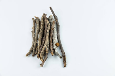 Pile of dry twigs on white background