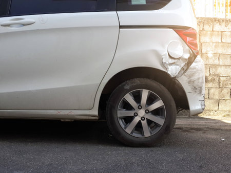 Details of a white car in an accident, Car crash, insurance, soft focus, light effect.の写真素材
