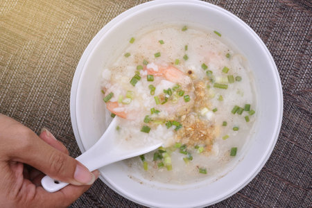 Top View Rice porridge with shrimp in white bowl, light effect.の写真素材