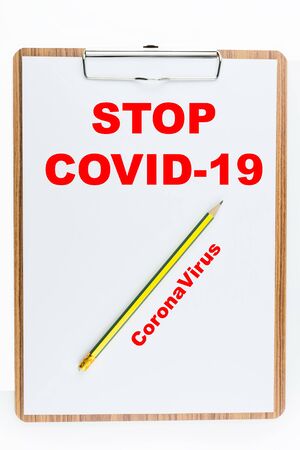 Stop coronavirus ,Covid-19 signage on note pad, Warning people.の写真素材