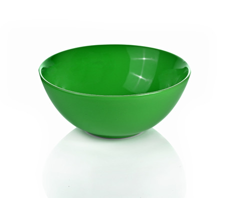 Empty green  ceramic bowl isolated white backgroundの写真素材