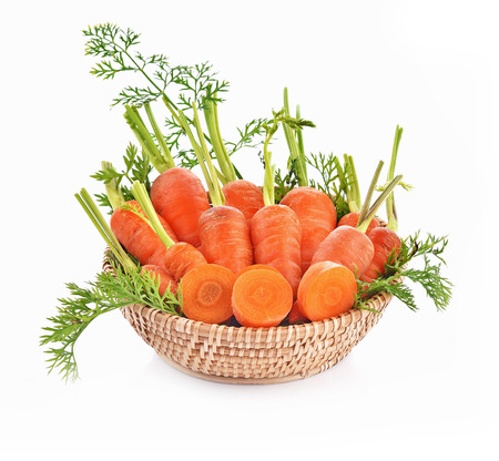 Baby carrot leaf fresh in basket on white backgroundの写真素材