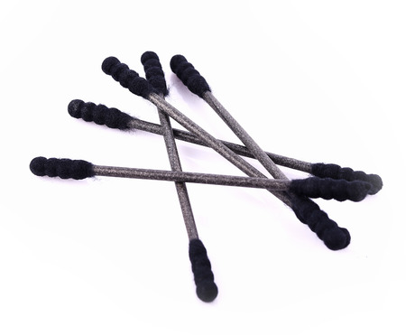 Cotton buds black plastic on white backgroundの写真素材