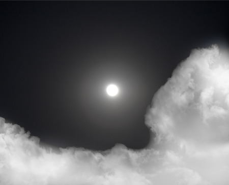 Clouds with moon on black background