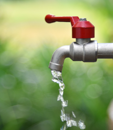 faucet water blur backgroundの写真素材