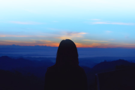 Woman with  watching a mountain viewの写真素材