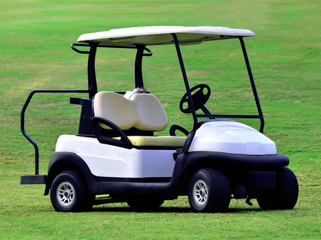 Golf one car on grass green backgroundの写真素材