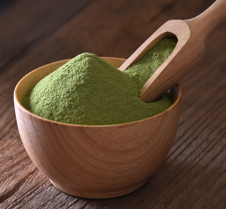 Green tea powder in bowl wooden on wooden backgroundの写真素材