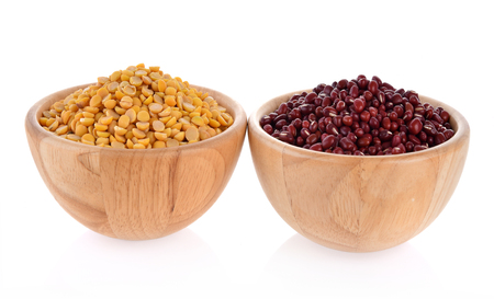 Soy beans, red beans, wooden bowls isolated on white backgroundの写真素材