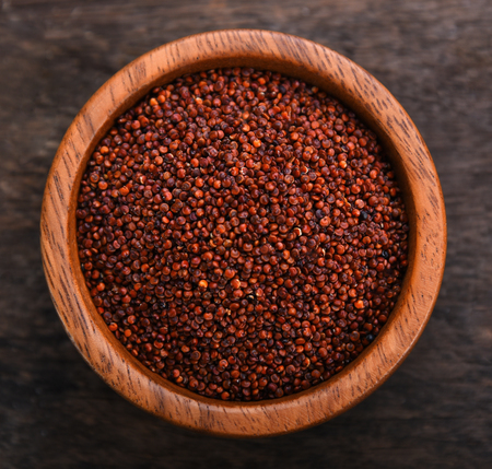 Quinoa in bowl on wooden background. top viewの写真素材