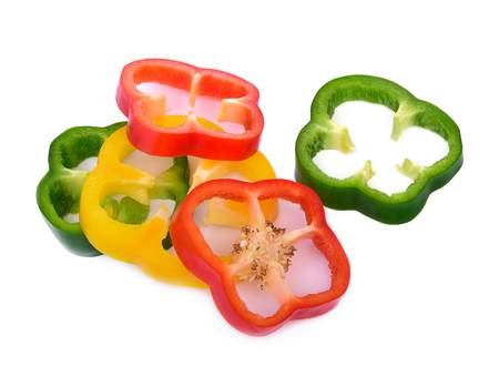 paprika sliced yellow, green, red isolated on white backgroundslicedの写真素材