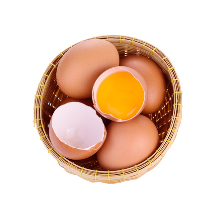 egg in a basket isolated on white background.の写真素材