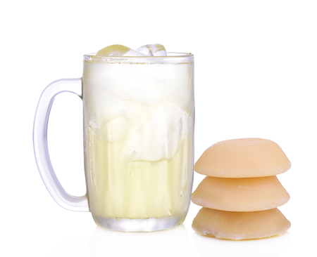 Palm juice of glass with ice and coconut sugar isolated on white background.の写真素材