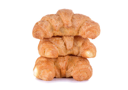 Fresh and tasty croissant over white backgroundの写真素材