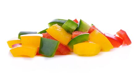paprika sliced yellow, green, red isolated on white backgroundslicedの写真素材