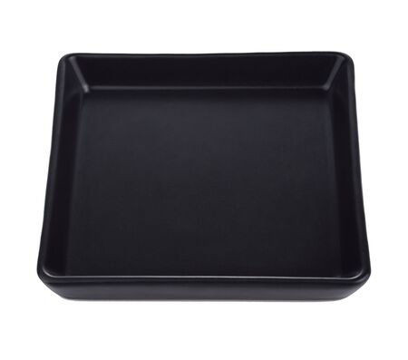 Black plate isolated on white backgroundの写真素材
