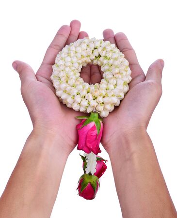 Thai Flower Garland with jasmine & roses on both hands put together as sign of respect & honour (flower garland is widely given on Songkran festival & Mother's day in Thailand) isolated on whiteの写真素材