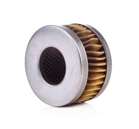 Old automotive oil filter cartridge isolated on a white background.の写真素材