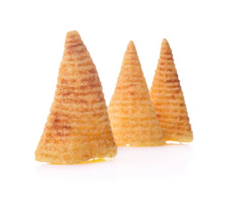 Crunchy corn snacks on a white backgroundの写真素材