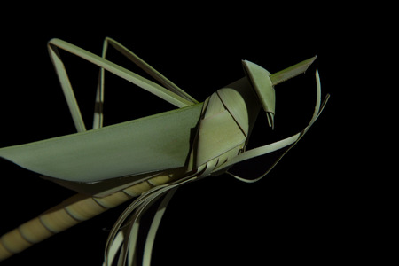 Grasshoppers made of coconut leaves