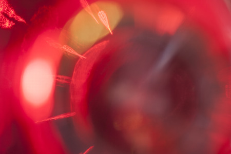 Abstract colorful background. Defocused blurred lights behind a glass surfaceの写真素材