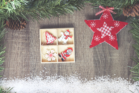 Christmas background with fir tree and decorative elements on a wooden boardの写真素材