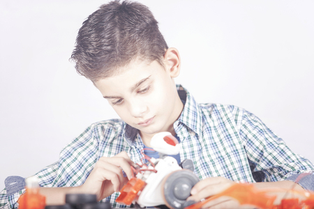STEM education concept with little boy building a robotの写真素材