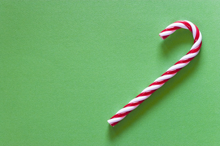 Christmas candy on a green background with copy space. Top viewの写真素材