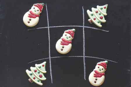 Christmas tic tac toe board game with chocolate candiesの写真素材