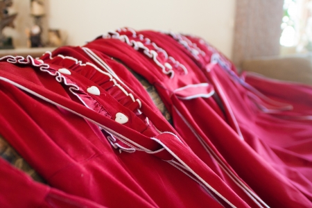 Red dresses in a rowの写真素材