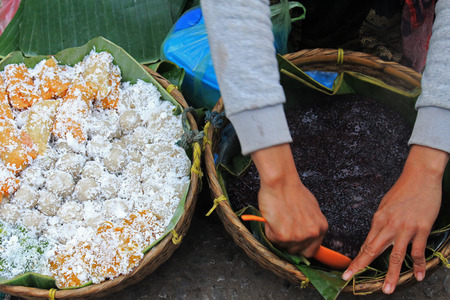Woman hands with traditional Thai dessertsの写真素材