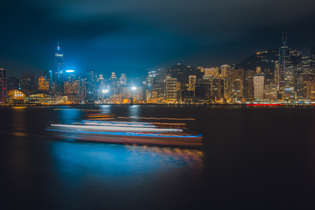 Hong Kong Victoria Harbor day and nightの写真素材