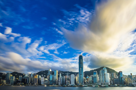 Hong Kong Victoria Harbor day and nightの写真素材