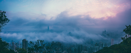 Hong Kong Victoria Harbor day and nightの写真素材