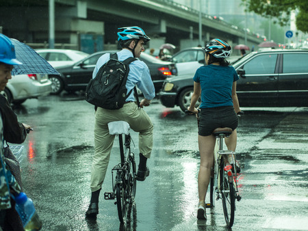 bike ride during rainy day in Beijingのeditorial素材