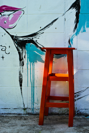 Red Chair with Art Backgroundの写真素材